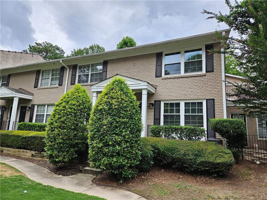 Don't miss out on this freshly painted 2 bed 1.5 bath condo located in Atlanta. Gated community with assigned parking. New carpet upstairs and beautiful real hardwoods on the main level. Bathroom was just renovated and features a shower tub combo. Kitchen features updated appliances and granite tile counters. Half bath on the main level. Private fenced patio located outside of the kitchen. Washer and Dryer are included. Landscaping and trash provided by HOA. Pets are on a case by case basis with a non-refundable $250 per pet fee due at move in.