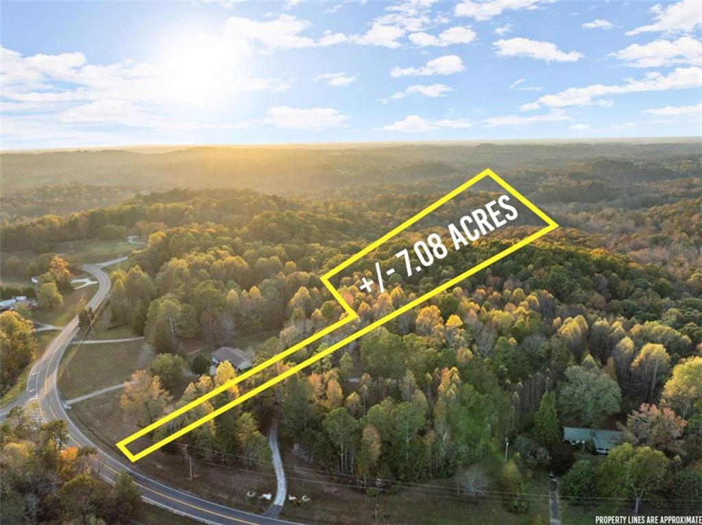 This beautiful 7-acre tract in North Hall offers the perfect blend of privacy and potential, featuring 90 feet of road frontage on Cleveland Highway (Hwy 129) with convenient access to city amenities, including water, power, and high-speed internet. The land, zoned AR-IV, boasts gently rolling terrain filled with mature hardwoods, creating an ideal setting for a private residence with multiple homesite options throughout. With a new survey and approved soils already on record, this property is ready for development. For those with a vision, future commercial opportunities may also be possible, pending county zoning approvals. Measuring approximately 228 feet wide by 1,171 feet deep, this acreage provides ample space, modern amenities, and investment potential in a quiet, scenic setting. Adjoining property at 4701 Cleveland Hwy w/house can be purchased also.