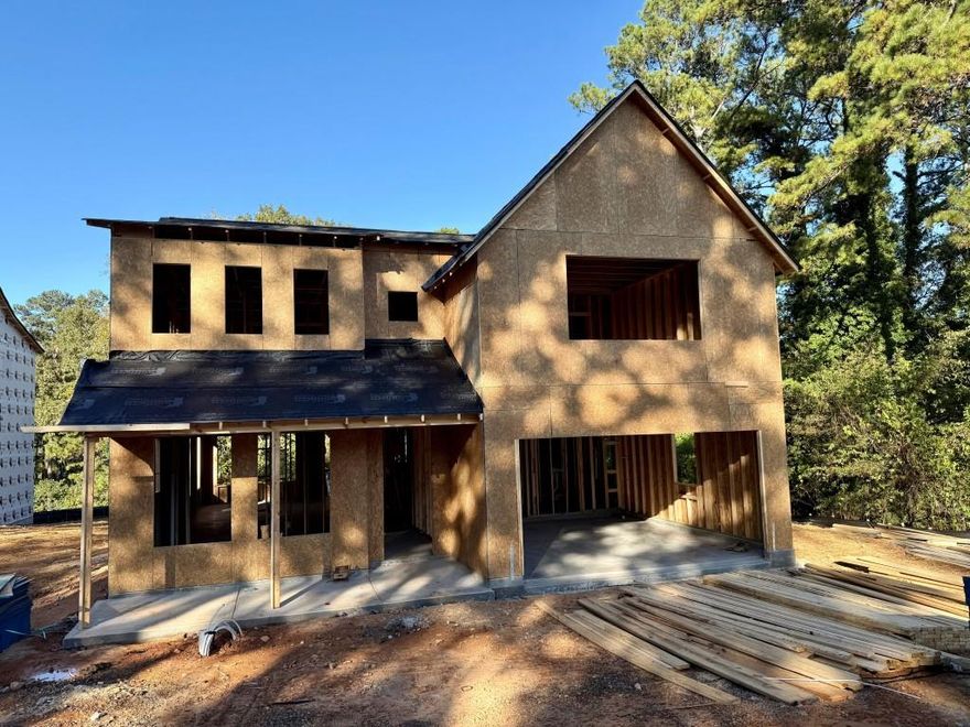 The Melissa Plan built by a Custom Builder. This beautifully crafted home will not disappoint! Designed with comfort, elegance, and functionality in mind, this Primary on Main floor plan greets you with elevated ceilings and rich details throughout. The separate dining room with coffered ceilings sets the stage for memorable gatherings, Stunning wood flooring flows seamlessly into the spacious family room, accented by exquisite trim work -perfect for hosting friends and family. At the heart of the home, the gourmet kitchen shines with an abundance of softclose cabinetry, gleaming quartz countertops, a generous island with bar seating, and stainless steel appliances including double ovens and a built-in microwave drawer. The Primary Suite, privately tucked away on the main level, boasts a trey ceiling and private access to the covered patio. Step into the luxurious ensuite featuring a tiled shower with glass enclosure, soaking garden tub, quartz countertop vanity, and a sizeable walk-in closet to keep everything organized. A tiled laundry room and powder bath add everyday convenience to the main level. Upstairs, a spacious loft area provides the perfect spot for homework, gaming, or a cozy lounge. Each secondary bedroom is complete with its own en-suite bathroom, offering comfort and privacy for everyone. This home truly has it all - style, space, and thoughtful design! Home will be ready January/February 2026.