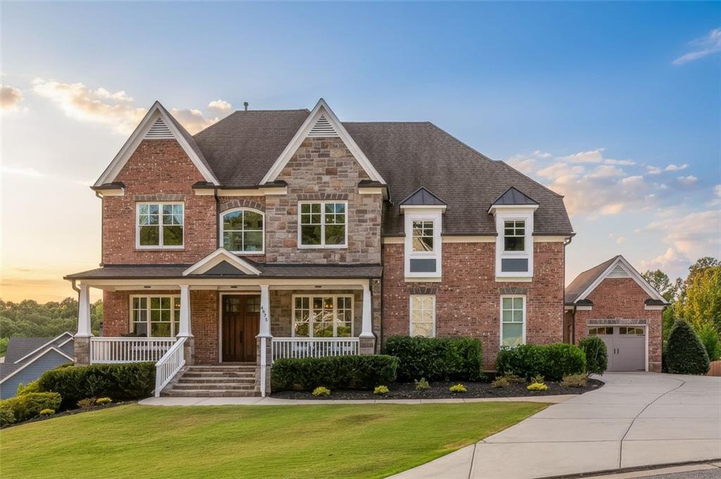 ** VIDEO: Be sure to check out our 20 minute+ walkthrough video on YouTube or on the virtual tour website ** 4675 Bluffside Court represents a rare opportunity in East Cobb’s Lassiter High School district, one of the most sought-after communities in Metro Atlanta. Completed in 2017 and meticulously enhanced by the original owners with more than $370,000 in thoughtful upgrades, this seven-bedroom, four-and-a-half-bath residence offers nearly 5,500 square feet of beautifully finished interiors designed for both elegance and ease of living. The three-sides brick exterior is complemented by a wide front porch and a covered rear deck with views of Sweat Mountain. Inside, the main level features a private office with French doors, a full guest suite, and an expansive great room that flows seamlessly into the chef’s kitchen. Appointed with Wolf and Cove appliances, a Bespoke refrigerator, granite counters, and a generous island, the kitchen balances functionality with refined design. The owner’s suite occupies a private wing upstairs and includes a sitting area, two Elfa-designed walk-in closets, and a spa-inspired bath with Restoration Hardware vanities, a freestanding soaking tub, and an oversized shower. Three additional bedrooms and a bonus room complete the second level. The finished terrace level expands the home with two bedrooms, a full bath, and a spacious living area with provisions for a kitchenette, making it ideally suited for multi-generational living. A rare finished third story offers a half bath and flexible space for a seventh bedroom, recreation room, or study. Throughout the home, premium hardwood flooring, custom closets, designer lighting, upgraded mouldings, and epoxy-finished garages reflect the quality of every detail. The location enhances the lifestyle, with nearby Sweat Mountain Park, Mabry Park, East Cobb Park, and Noonday Creek Trail offering abundant outdoor recreation, and quick access to The Avenue East Cobb, downtown Woodstock, and Alpharetta ensuring convenience. 4675 Bluffside Court combines luxury, location, and livability in one of Cobb County’s premier settings.