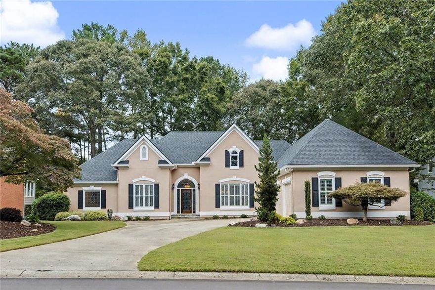 Beautiful ranch on a golf course lot in Towne Lake Hills East, one of Woodstock’s premier golf communities! This well-maintained home offers easy main-level living with plantation shutters throughout, vaulted ceilings, and an open, light-filled floor plan. The spacious great room with fireplace opens to the dining area and bright kitchen with a new dishwasher. The primary suite features a tray ceiling, dual walk-in closets, and a spa-like bath. Two additional bedrooms share a jack-and-jill bath. The finished basement includes a large rec room, full bath, and generous storage/workshop space. Relax outdoors on the screened porch, deck, or covered patio overlooking the golf course views and astro-turf backyard. Other highlights include front accent lighting, full irrigation capability, a 3-car garage, and a new thermostat. Enjoy Towne Lake Hills East amenities—golf, swim, tennis, clubhouse—and proximity to downtown Woodstock, shopping, and top schools!