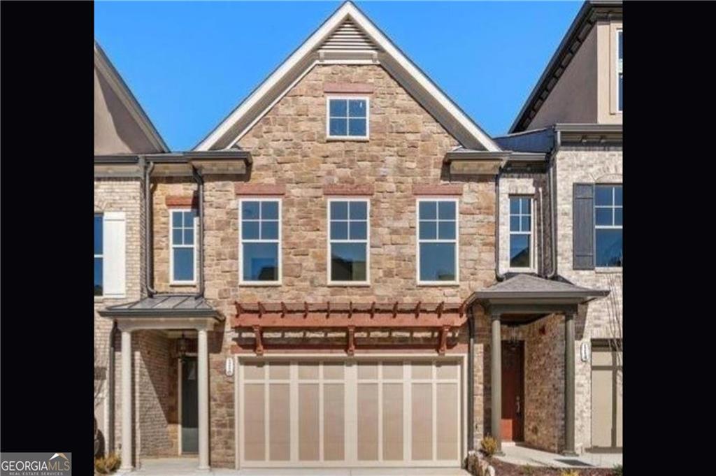 Beautiful, gates Tuscan inspired townhome built by Kittle Homes near desirable downtown Woodstock area. Home is in this attractively landscaped community with community pavilion with outdoor fireplace, fenced dog park, and bocce court to enjoy. The Volterra plan boasts open concept kitchen, dining and living space. The main level has seamless open space design and oversized windows provide great lighting and the gourmet kitchen has an oversized island with breakfast sitting. This home has a butler's pantry and large laundry room with built-in cabinetry and a utility sink adds to the beauty and functionality of this perfectly maintained home. Outdoor entertaining includes covered patio and privately fenced yard. Elegant, curved staircase brings you to spacious 2nd floor. Second floor has loft, large owner's suite with 2 walk-in closets and ensuite master bath with his & her vanities, walk-in shower and free-standing tub. Private Fenced Back Yard. 2 Car Garage.
