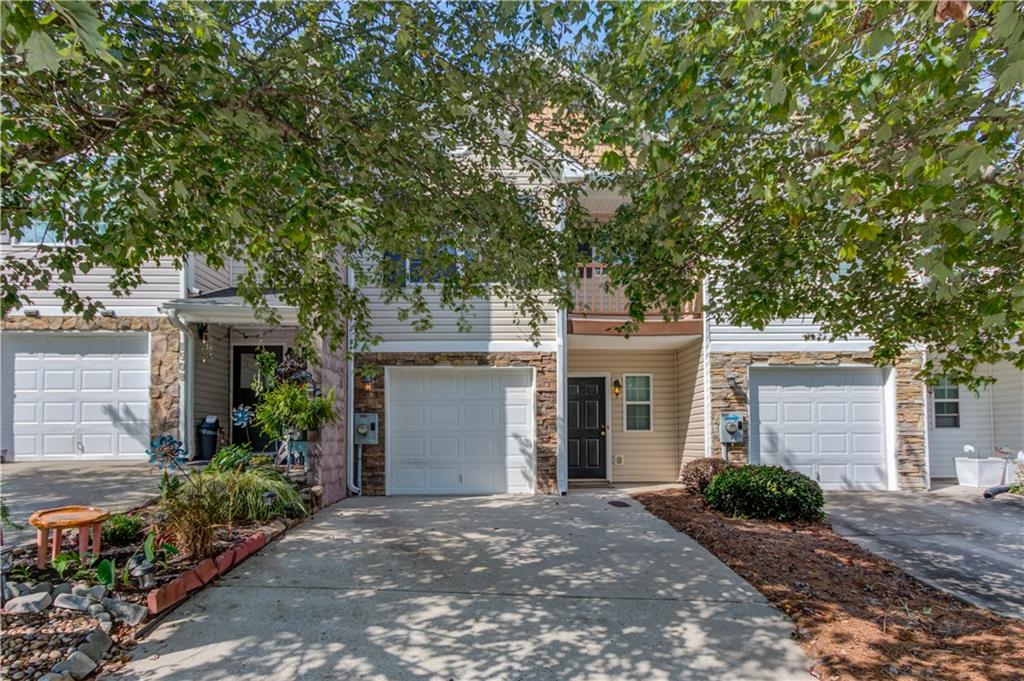 WOW! Fantastic First Time Home Buyer option or investment opportunity! Seller has completed numerous upgrades including new HVAC in 2024, Air duct cleaning, new stainless kitchen appliances, new window blinds and new paint throughout the home! This attractive townhome has been well maintained and features LVP flooring throughout the main living areas including the kitchen and living/dining areas. The stacked stone fireplace adds a warm touch while the open concept living plan allows you to cook and entertain with ease. The updated kitchen is ready to go with new appliances, pantry, plenty of storage and a great breakfast bar for casual meals. Easy access to the back patio makes BBQing or enjoying the cool Fall weather a breeze and backs up to a wooded area providing privacy and an air of peacefulness. A half-bath conveniently rounds out the main level of the home. Upstairs you will find a spacious Primary bedroom with a sitting area and Juliet balcony! The ensuite bathroom offers a relaxing soaking tub, separate shower and great closet for storage! Two additional bedrooms and a full bath as well as a convenience upstairs laundry area provide all the space you need! Turtle Creek Villas offers a lovely pool, tennis courts & a great clubhouse! Near all area amenities this home is ready to go!