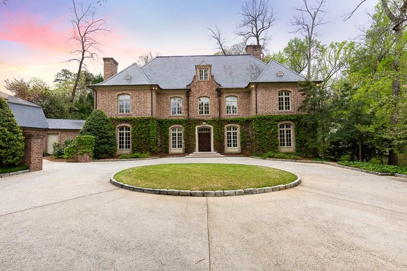Located in one of Buckheads most desirable neighborhoods, this handsome updated traditional home was created by Atlanta's premier design team of Norman Askins, Yon Pak, Jerry Bonner (builder) and Ed Dougherty (landscape). A design with a french chateau flair, the entry sets the tone w/ it's 16th century French designed "old world" plaster walls and custom wrought iron handrail. The home is comprised of 6 bedrooms, 7 baths. 3 car garage with extensive storage has a ready to be finished in law or au pair suite w/ separate entrance.