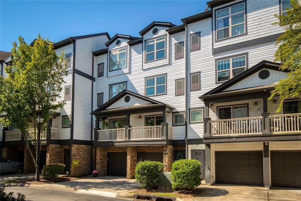 Surround yourself with the best of Atlanta! Located just between Buckhead & Midtown with access to the BeltLine Westside Trail. This unit has additional windows and additional parking. The one car garage has ample storage, access to the backyard area & additional parking in the driveway - enough for 2 cars. The main floor includes the open living & kitchen area with granite countertops and stainless steel appliances - new dishwasher & refrigerator. A powder room is also available on the main floor for guests. Upstairs you will find the secondary bedroom & ensuite bathroom with walk-in shower. Just past the stackable washer & dryer you will find the primary suite with vaulted ceilings, ensuite bathroom and ample closet space. Along with convenience, City Park Townhomes has a dog park and tennis court. Water, sewer & all exterior maintenance are included in the HOA fees. In town living at its finest.