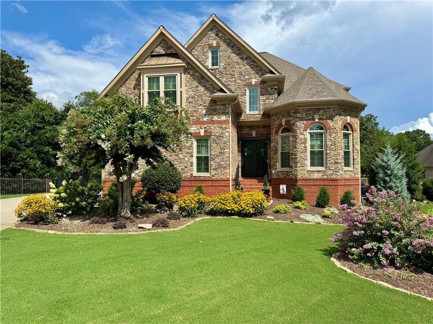 This gorgeous, beautifully updated home in Haynes Manor subdivision features a salt water pool and spa with waterfall, outdoor fireplace, and is an entertainer's dream.  A soaring two-story foyer flanked by the living/dining room combo leads on to a two-story family room and gourmet kitchen featuring designer appliances such as a 6-burner gas cooktop with double-motored vent fan and double ovens. The home was custom built with stunningly beautiful millwork, has plantation shutters throughout, and has hardwood floors throughout the main floor.  Upstairs, the large master suite with tray ceiling features a gas fireplace, bookshelves, sitting area, covered balcony, and a large walk-in his and hers closet with closet system.  The large master bath features a vaulted ceiling with large, separate his and hers vanities, a large tile and granite shower, jetted/whirlpool tub, heated tile floors and a heated towel rack.  3 additional large bedrooms and 2 bathrooms along with a laundry room completes the upstairs.  The finished basement/terrace level features a pool table and bedroom with full bathroom, a large custom bar with custom cabinets enclosing a mini-fridge and dishwasher for easy entertaining, and an adjacent sitting area with bookshelves and a fireplace.  The outdoor terrace provides a covered seating area leading to the large back yard which is landscaped with stone hardscape and lighting surrounding the pool/spa area and outdoor fireplace.  Additional features of the home include smart-home technology such as WiFi controlled switches and garage doors, WiFi controlled and automated pool/spa systems, pre-installed sensors and cameras for a SimpliSafe alarm system, a large volume Rinnai tankless water heater, among others. The home is conveniently located with neighborhood shopping and dining less than a mile away. The NorthPoint Mall shopping area is just 5 minutes away and downtown Alpharetta and Avalon are just 10 minutes away.