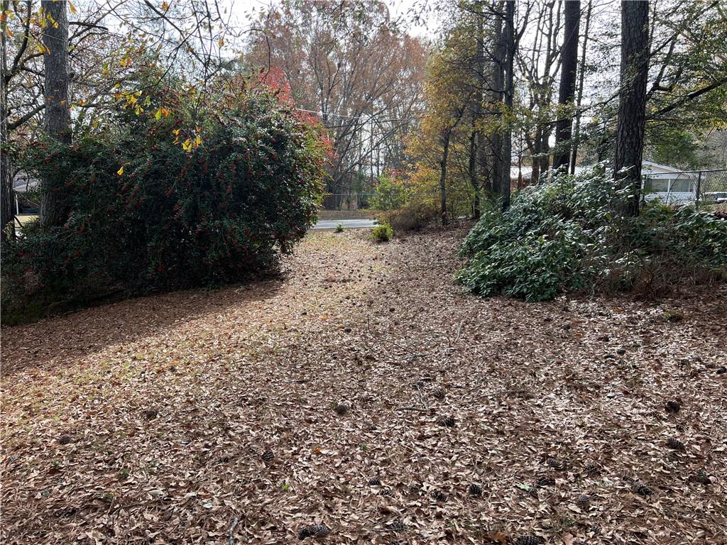 Welcome to your own private sanctuary nestled in the heart of nature! This wooded 4.16-acre lot offers privacy and a tranquil stream -the perfect canvas for your dream home. A beautiful space for your custom residence, you'll have the freedom to design the ultimate retreat tailored to your preferences. Convenience meets tranquility with easy access to nearby amenities, including shopping and dining at Canton Marketplace, ensuring that you can enjoy both the seclusion of nature and the comforts of modern living. Plus, with Northside Hospital Cherokee just a stone's throw away, you'll have peace of mind knowing that essential services are within reach. Don't miss this rare opportunity to own a slice of paradise in a prime location. Schedule your private tour today and start envisioning the life you've always dreamed of! Level 3 Soils report has been completed on a portion of the property, and seller will have survey completed prior to closing.