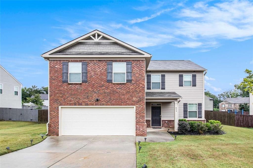 Discover comfort and style in this 4-bedroom, 2-bath home built in 2020, featuring a spacious open-concept layout perfect for modern living and entertaining. The kitchen showcases a granite island ideal for casual breakfasts, along with a dedicated dining area for more formal meals. The inviting family room centers around a cozy fireplace, creating a warm and welcoming atmosphere. Retreat to the private owner's suite, complete with dual vanities, a separate shower, and a luxurious garden tub designed for relaxation. Enjoy community amenities including scenic walking trails, a sparkling pool, and playground-offering something for everyone to enjoy. This home is also eligible for 100% USDA financing-an incredible opportunity for qualified buyers!