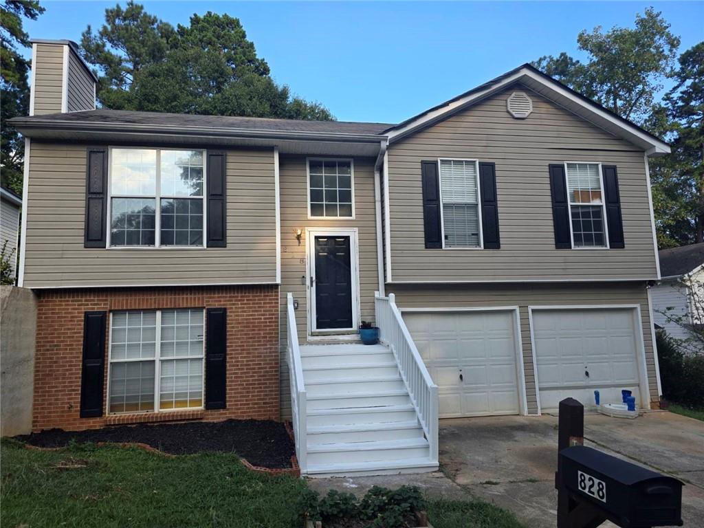 Welcome to this charming split-level home featuring 3 bedrooms and 2 full baths in a convenient location just minutes from Rockbridge Road, Scenic Highway, Stone Mountain Park, shopping, and dining. The light-filled layout offers a spacious family room with a cozy fireplace, a kitchen with stained cabinets, and a generous dining area perfect for gatherings. Step outside to the deck overlooking the private backyard, a great space for relaxing, gardening, or entertaining. Packed with space and loaded with potential, this home is being sold As-Is and offers an excellent opportunity to update and make it your own. No HOA.