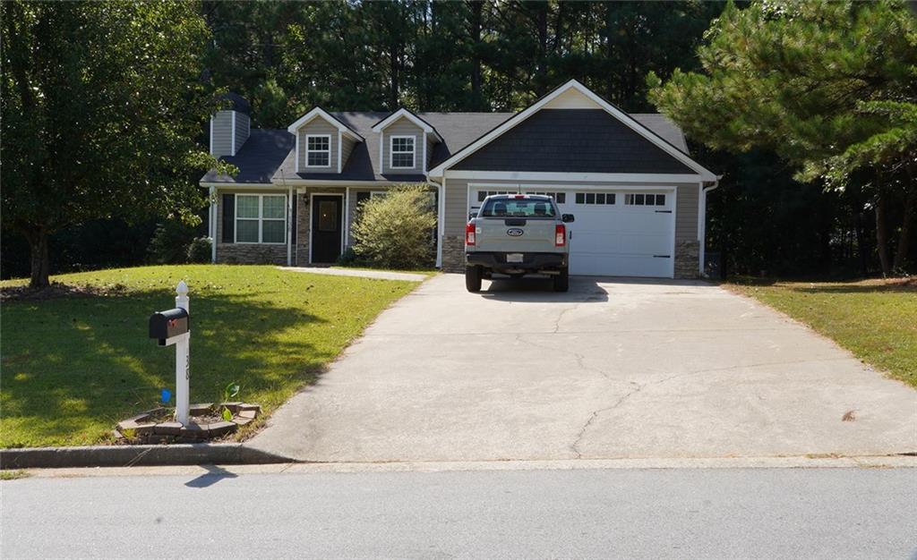 Welcome home to this well-kept 3-bedroom, 2-bath ranch nestled on a serene 0.52-acre homesite. Bathed in natural light, the inviting layout centers around a warm living room featuring a striking stone fireplace—perfect for cozy evenings. The eat-in kitchen offers ample space for casual dining and shines with stainless steel appliances.
Retreat to the spacious primary suite with a tray ceiling, generous walk-in closet, and a spa-like bath complete with a stand-up shower and relaxing soaking tub. Two additional bedrooms and a hall laundry closet add everyday convenience.
Enjoy peace of mind with a security system and cameras that convey with the home. A roomy 2-car garage provides extra storage and parking, while the expansive yard offers space for gardening, play, or outdoor entertaining.
Combining comfort, style, and practicality, this charming ranch is move-in ready and moments from everyday amenities. Don’t miss your chance to make this light-filled home on over half an acre yours!