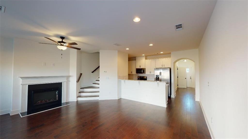 This beautifully designed townhome offers an abundance of natural light throughout its open concept floor plan. The home features 3 bedrooms, 2.5 bathrooms, a 1-car garage, and a driveway accommodating up to 2 cars. The interior boasts elegant stone countertops, a gorgeous designer backsplash, stunning dark cabinets with silver accents, and stainless steel appliances. Enjoy the convenience of an included washer and dryer on the top level. The master bath is a luxurious retreat with a separate tub and shower, double vanity, and a spacious walk-in closet. The additional bedrooms are generously sized. This home is all hardwood flooring, adding to its charm and easy maintenance. The fully fenced yard is perfect for entertaining, and lawn care is maintained by the HOA. Located in a beautiful new community in Stonecrest, you’ll be near shopping, grocery stores, Stone Mountain, and I-20. Plus, the home is right across the street from Redan Recreation Center. Don’t miss out on this stunning rental opportunity!