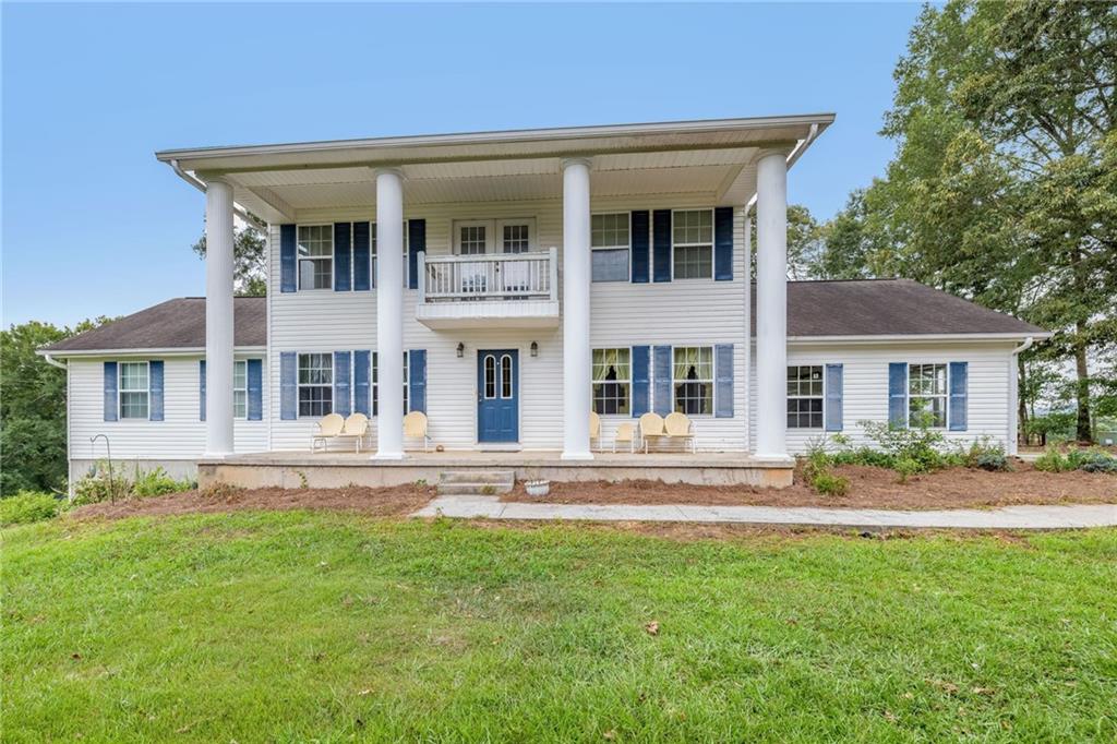 BEAUTIFUL HOME IN BANKS COUNTY!!! With room to roam, a porch to rock on, and 2 acres of pure peace and quiet, you will love all of the country charm this almost 3000 sf home on an unfinished basement has to offer. Tucked down a gorgeous, rural road in Alto, this spacious 3 bed, 3.5 bath home has the perfect balance of privacy and comfort-with just enough land to spread out without spending your weekends mowing. Step inside to nearly 3,000 square feet of inviting living space, complete with large rooms, tons of natural light, and a layout that flows perfectly whether you're hosting friends or just enjoying a quiet night in. When I say the rooms are big, I mean all of the rooms are so big! The rocking chair front porch features 4 huge columns and leads you into a foyer with a dining room and living room on each side. Walk on in to another living area that leads to a covered porch that has a fantastic view to the 18 x 36 inground swimming pool. Located on the main level, the primary bedroom displays all things MASSIVE...the bedroom itself, the ensuite bathroom, and closet! The eat in kitchen has a extra large walk in pantry and the laundry/mudroom is off from the kitchen. There's also a powder room on the main level. Upstairs is another 2 oversized bedrooms with each having their own bathrooms, a flex room/space, and a balcony that overlooks the front yard. Give your teen a microwave and mini fridge and they will be set! There's a daylight unfinished basement with lots of storage that could easily be finished for an in law suite or whatever you would like. Outside, enjoy plenty of room for a garden, play things for the kiddos, and all of your summer outdoor gatherings. Close enough to town for groceries and coffee runs, but far enough out to enjoy peace, stars, and still mornings. The seller is surveying 2 acres from original 10 acre parcel and is currently clearing trees for a pasture. Convenient to shopping and restaurants, you are 10 minutes to Cornelia, 25 minutes to Gainesville, 10 minutes to Homer, 15 minutes to Commerce, 45 minutes to Athens, around one hour to Atlanta, and a short drive to the NE GA Mountains and surrounding Lakes. Come make the quiet life yours here at 113 Wynn Wood Lane.;)
