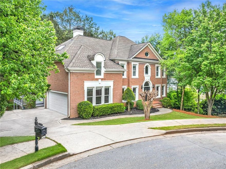 Wow! Don't miss this stately 6 bed, 5 bath, 4-sided brick, move-in ready traditional home with loads of natural daylight, guest suite on the main level, updates throughout, full finished daylight terrace level and more, all situated on a quiet cul-de-sac in the highly sought-after Alpharetta/Johns Creek swim/tennis community of Chartwell! The spacious main living level offers a formal living room, formal dining room, large guest bedroom, updated full bathroom, laundry room with utility sink, and the fabulous updated kitchen complete with quartz countertops, stainless appliances, double oven, pantry, and adjacent breakfast area open to the striking vaulted fireside family room, all overlooking the peaceful, private tree-lined backyard! Upstairs, you’ll find three spacious guest bedrooms, two guest bathrooms, and the oversized retreat-like primary suite with trey ceiling detail, fireplace, and the renovated spa-like ensuite bath featuring a double vanity, walk-in shower, and separate centerpiece soaking tub! The full, finished daylight walk-out terrace level includes an additional family room, media room, bonus space, guest bedroom, and full guest bathroom! This home offers plenty of opportunity for outdoor entertaining with an expansive, low-maintenance Trex deck on the main living level, and a green space for additional activities! Driveway parking pad provides space for multiple cars or basketball play. Chartwell community includes pool, tennis courts, clubhouse, playground, and a community lake, and is located just steps to Newtown Park, shopping, restaurants, and more! Easy access to GA 400! DON’T WAIT, be sure to schedule your showings ASAP!