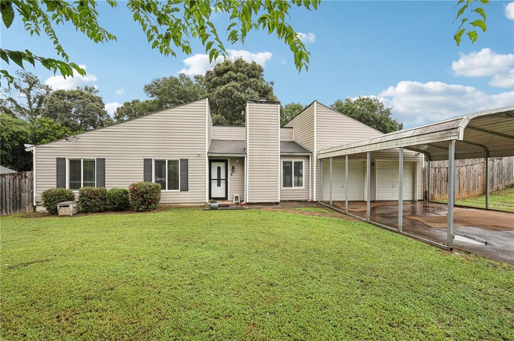 Welcome home to this inviting 3-bedroom, 2-bath ranch-style gem with a 2-car garage, nestled on a spacious and level ½-acre lot, perfect for outdoor living, pets, and play!
Step inside to a warm and open great room featuring vaulted ceilings and a cozy fireplace, flowing seamlessly into the dining area, ideal for entertaining. The kitchen offers ample cabinet space, a gas stove, butcher block countertops, and everything you need for comfortable home cooking. The private owner’s suite boasts a beautifully updated bathroom, while the secondary bathroom has also been tastefully renovated. Out back, enjoy the peaceful setting from the covered patio overlooking the expansive yard. You’ll also find a small storage shed and a huge 16x24 fully insulated workshop with electricity—perfect for hobbies, storage, or even a future home office or gym. Don’t miss this one! It has the space, charm, and functionality you’ve been looking for!