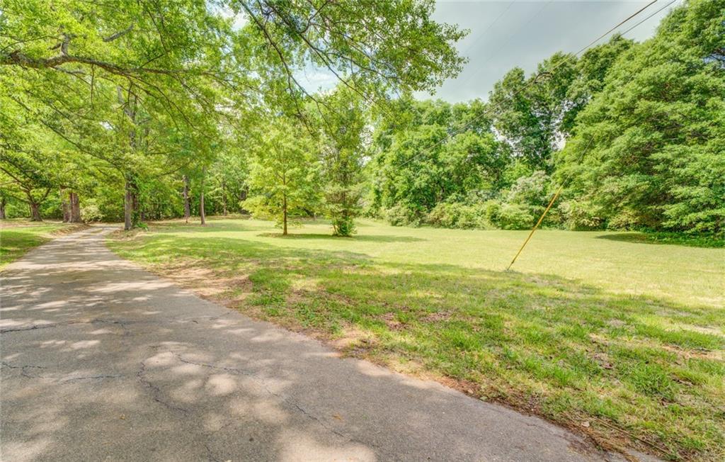Location, location, location! Zoned commercial highway located on Highway 162 this 11.58+/- acres includes 201 feet of road frontage and is centrally located close to Covington, Porterdale, Conyers and McDonough. Power and water available just need to be hooked up. There is also a well on the property. Please call to schedule an appointment.