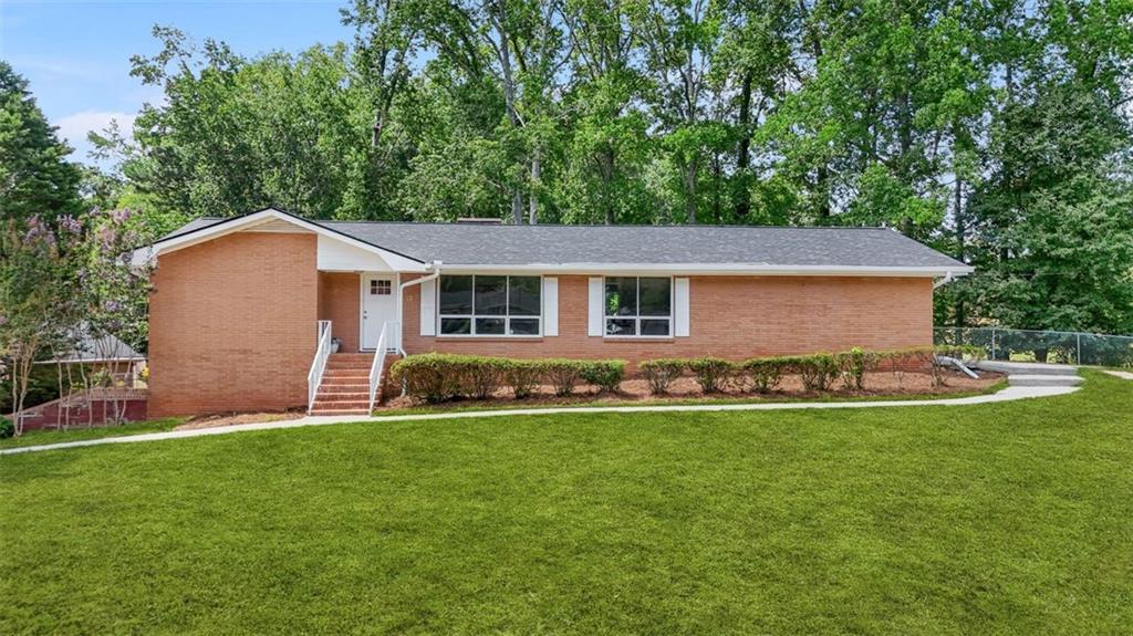 **Spacious 5-Bedroom Ranch on Finished Basement | Newton Plantation | \$395,000**
Welcome to this beautifully updated 4-sided brick ranch nestled on a private, level corner lot in the desirable Newton Plantation community of Fayetteville, GA. Offering incredible space, flexibility, and income potential, this home is perfect for multi-generational living or savvy homeowners looking to offset their mortgage.
Step inside to find **new flooring**, **fresh paint**, and a **brand-new HVAC system**, making this move-in ready home both stylish and worry-free. The main level features a **spacious master suite**, **3 additional bedrooms**, and **2 full bathrooms**, along with a formal **living room**, **dining room**, **family room with fireplace**, and a bright **sunroom** perfect for relaxing.
The **updated kitchen** boasts **granite countertops**, **white cabinetry**, and a cozy **breakfast area** that opens to the family room. A convenient **laundry room** and a **2-car garage** complete the main level.
Downstairs, the **finished basement** offers incredible potential with a **private entrance and separate driveway**, **garage**, a large **living area with fireplace**, **bedroom with walk-in closet**, **full bathroom**, and a **bar area with sink** that could easily be converted to a full kitchen — ideal for use as a rental, in-law suite, or guest retreat.
Outside, enjoy a **fenced backyard** perfect for pets or play. This well-maintained home offers the perfect blend of comfort, functionality, and flexibility—all in a peaceful neighborhood with no HOA.
Don't miss this rare opportunity—schedule your private tour today and discover all the possibilities this home has to offer!