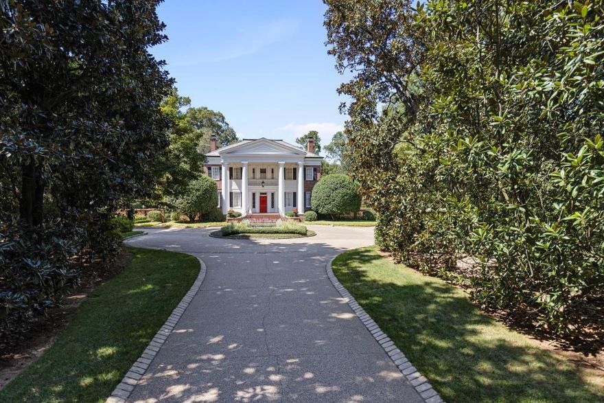 Built in the late 1930's, Magnolia Hill is one of the few remaining properties with 12.5 acres of beautifully manicured gardens surrounded by woodlands in the middle of Buckhead. The first introduction to this amazing property is the long private driveway entrance, lined by mature magnolia trees, and gracefully leading toward a circular fountain in the foreground of the stately Southern-style home. The house with its grand foyer, high ceilings, three fireplaces, hard wood floors, and graciously classic living spaces is immaculate and a welcoming place to call home. The property offers a fully finished terrace level with its own bedroom and kitchen; a totally livable guest house, with 2 bedrooms and a kitchen, overlooking the large rectangular pool and jacuzzi; a tennis court; a two-car garage with an apartment below; and an original "barn" ideal for an indoor children's play space.  Conveniently located near Atlanta's public and private schools and close to 75/85 for easy access to all areas of the city, this lovely estate property is a must-see for discriminating buyers seeking unparalleled privacy, beauty, and solitude.