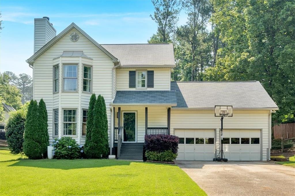 You will love this wonderful home situated on a cul-de-sac in a tranquil, well-established neighborhood. Conveniently located to everything just off Barrett Parkway and minutes to Marietta Square and Kennesaw Mountain. Inside this beauty you'll find real hardwood floors throughout the home, with tile in the bathrooms and kitchen. The family room is spacious enough to accommodate sectional or modular furniture, with a beautiful fireplace as focal point. Enjoy entertaining? The well-appointed kitchen offers ample counter space, an island for preparation, eating, or serving, gas stove, a new sink, large pantry, and laundry area that can also be used as a "drop zone" entering from the garage. A recently updated half bath is located on the main level as well. The owner's bedroom is exceptionally large, with hardwood floors that extend to the secondary bedrooms. Both full bathrooms have been updated. A cozy sunroom provides the perfect space to relax, with a new extended deck for grilling and outdoor furniture. The large, fenced yard includes a fire pit area, shed, and an additional building currently used as a workout room. Perfect as a "man cave", "she shed" or workshop. The owners have lovingly maintained the home and cherish the friendly neighborhood. With the home being offered below current appraisal, there's potential for instant equity. Welcome Home!
