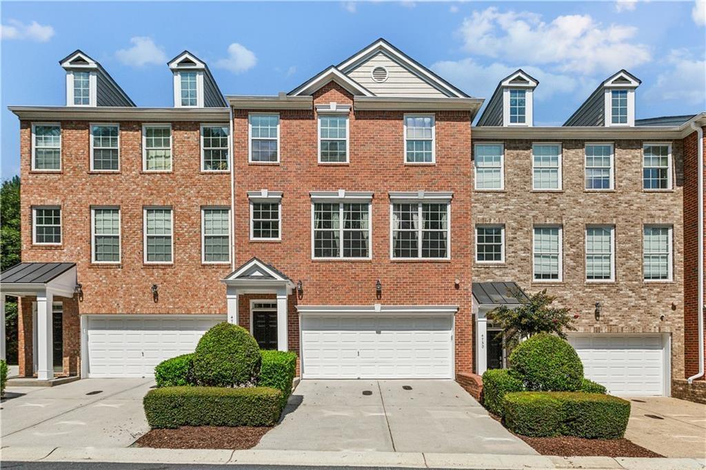 Welcome to this stunning Smyrna townhome. This modern residence offers 3 bedrooms and 3.5 bathrooms, fully renovated kitchen and primary bathroom and hardwoods throughout the main level, creating a perfect blend of luxury and comfort. The kitchen features a quartz island and backsplash, top of the line appliances including two beverage refrigerators and a gas range. Step onto your private deck with no neighbors behind for added privacy. The main level also features a sunny living room and half bath. Upstairs enjoy a spacious primary suite with a fully renovated bathroom. This space was thoughtfully updated to include a free standing tub and luxury shower. Both upstairs bedrooms benefit from generous walk-in closets and conveniently located laundry room. The lower level boasts a spacious bonus room plus the third bedroom and full bathroom. Additional outdoor space is accessible from the lower level as well as a pristine 2 car garage. The Villas at Creekside is ideally situated in a prime location near major highways, abundant restaurants, shopping and entertainment as well as the Silver Comet Trail.