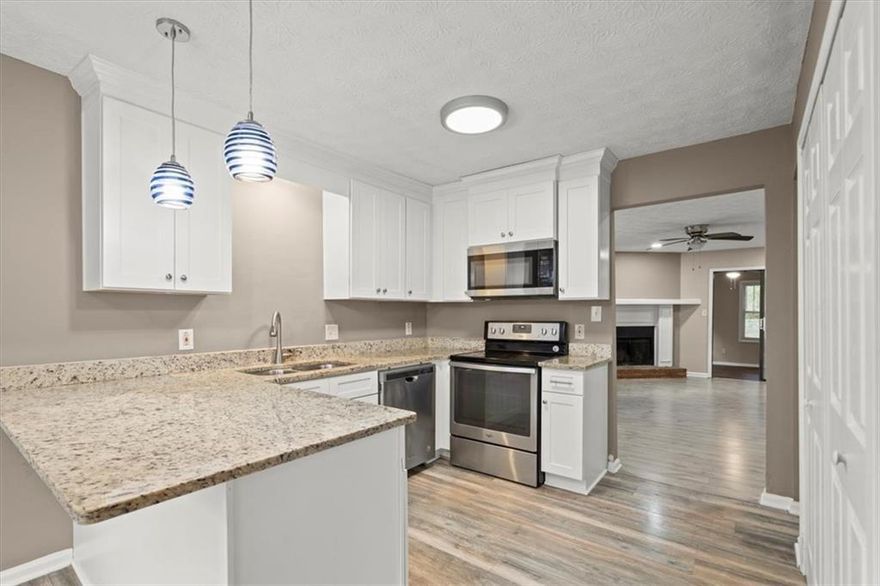 This inviting 1,338 sq. ft. townhome offers comfort, convenience, and plenty of charm. The open floor plan features a bright living room with a cozy fireplace, perfect for relaxing or hosting. The kitchen includes generous counter space, ample cabinetry, and a designated dining area for everyday meals or entertaining.

Both bedrooms are well-sized retreats. The primary suite offers a private bath and a large closet, while the secondary bedroom is perfect for family, guests, or a home office. Throughout the home you'll find easy-to-maintain flooring, abundant natural light, and thoughtful storage.

Step outside to a fenced backyard ideal for enjoying quiet mornings, grilling out, or letting pets play safely. This home also includes in-unit laundry hookups, central heating and cooling, and plenty of storage options.

Location is everything, and this home delivers. Just 3 miles from Downtown Woodstock, you'll be minutes from award-winning restaurants, boutique shopping, live music at the amphitheater, and year-round community events. Whether it's a Saturday stroll through the farmers market or dinner and a concert, all of Woodstock's charm is practically at your doorstep. Quick access to I-575 makes commuting a breeze, while the property is zoned to highly rated Cherokee County schools.

Flexible Lease Terms - 6mos/12mos/18mos/24mos - Pets considered with approval. No smoking. Tenant responsible for some utilities.