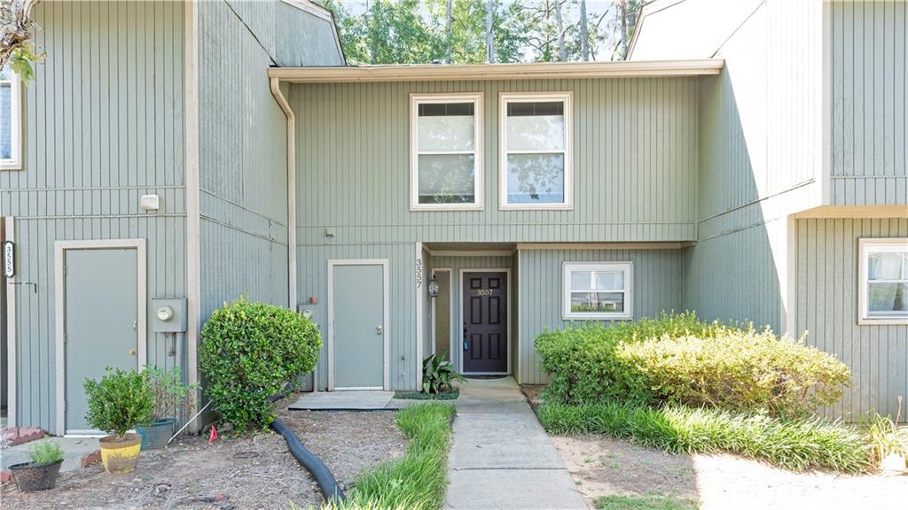 Beautifully Updated Townhome 3 Bedrooms, 2.5 Bathrooms. Welcome to this fully updated townhome located in a prime area close to shopping, dining, and easy access to the Interstate. This charming home features 3 spacious bedrooms and 2.5 bathrooms, offering comfort and style throughout. Freshly painted, the main level boasts gleaming hardwood floors and a cozy living room with a large stone fireplace. The master bedroom also features hardwood flooring for a touch of elegance. Enjoy cooking in the updated kitchen with white cabinets and stainless-steel energy-efficient appliances (only two years old). All bathrooms have been tastefully renovated with modern finishes and quartz countertops. New tile flooring has been installed in the bathrooms and laundry room. Additional features include: Energy-efficient double-pane windows throughout, solid wood doors and a new front entry door, new ceiling fans and modern lighting, freshly painted exterior storage unit with new shelving. Community amenities offer extra comfort and convenience, making this townhome an exceptional value.