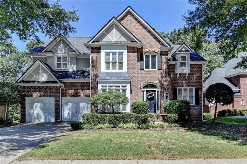 Gorgeous Golf Course Views & Private Retreat
Step into this beautifully maintained home featuring a guest suite conveniently located on the main level. A dramatic wall of windows in the great room fills the space with natural light and frames serene views of the private backyard, where trees create a peaceful setting along the golf course.
The expansive primary suite is a true retreat with a fireplace, tray ceilings, and a lovely bay window. The en suite bathroom delivers more “wow” moments with soaring vaulted ceilings, a private window above the soaking tub & separate vanities.
The kitchen is light, bright, and functional with white cabinetry, stainless steel appliances, and extra storage space—including glass display cabinets, built-in wine storage. Hardwood floors span both the main and upper levels, adding timeless charm throughout the home. The great room flows seamlessly to an oversized deck, ideal for entertaining or relaxing in total privacy.
Just off the entrance, a cozy office with custom arched built-ins provides the perfect workspace, while a separate flex room can be used as a formal dining room or bonus space. The unfinished basement ( 1,582 sf )offers walkout access, golf course views, and is already framed for future bedrooms and expansion—perfect for creating even more personalized living space down the road.
Living in Windward means access to exceptional resort-style amenities including a private 195-acre lake for boating and fishing, a sports park, walking trails, and the optional Windward Lake Club and Golf Club of Georgia memberships. Just minutes from top-rated schools, Avalon, and GA 400, this home offers both luxury and lifestyle.
