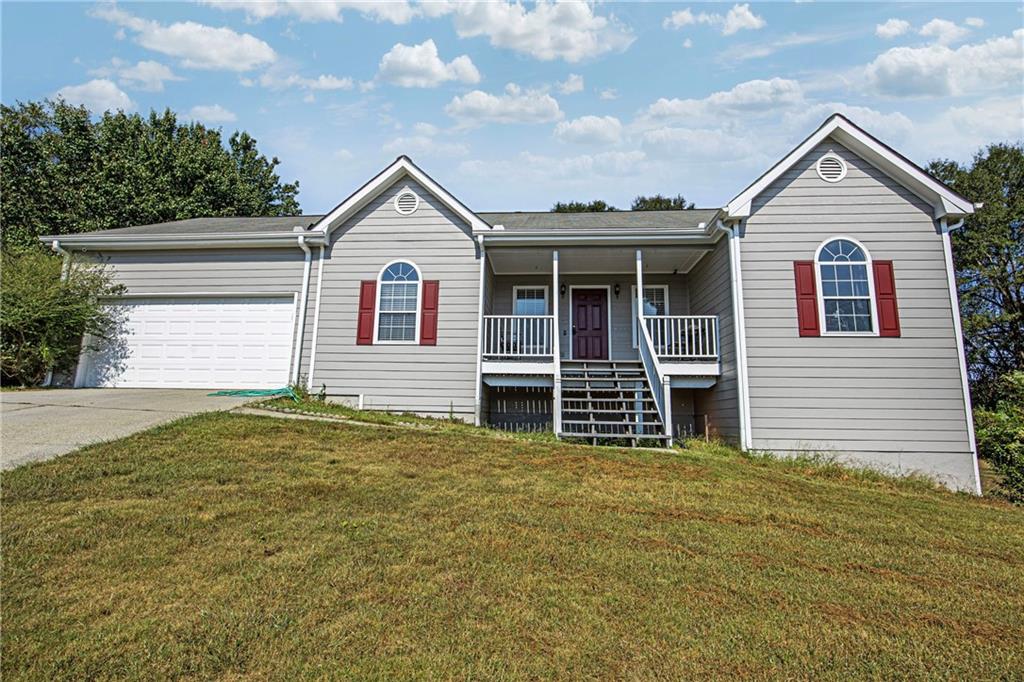 Don't miss your chance to own this rare ranch gem in the sought-after Twin Oaks Manor community! Nestled at the end of a quiet cul-de-sac on a spacious and private 0.57-acre lot, this well-maintained 3-bedroom, 2-bath home offers the perfect blend of comfort, privacy, and potential. Inside, you'll find 1,634 square feet of light-filled living space with vaulted ceilings, a separate dining room, and a cozy fireside family room. The open layout flows effortlessly and offers great sight lines throughout the home. Step outside onto your private back deck or relax on the covered front porch while enjoying peaceful, wooded views. One of the standout features of this property is the full, unfinished basement offering a blank canvas for future expansion. Whether you're dreaming of a media room, home gym, workshop, or additional living space, the possibilities are endless. With its unbeatable location, oversized lot, and full basement, this home is a rare find in Loganville's 30052 zip code. Properties like this do not stay on the market long schedule your private tour today before it's gone!