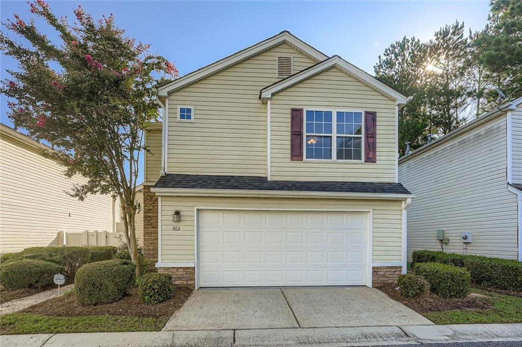 Welcome to this beautifully maintained two-story single-family home, perfectly situated on a low-maintenance lot in a desirable Acworth neighborhood. With a spacious 2-car garage and stylish curb appeal. Step inside to discover a stunning two-story great room filled with natural light and anchored by a cozy gas fireplace—perfect for relaxing or entertaining. The open-concept main level flows seamlessly into a dining area and the kitchen featuring white cabinetry, stone countertops, and a gas range. A convenient half bathroom completes the main floor. Upstairs, you'll find the primary suite with a private ensuite bathroom, along with two additional bedrooms and a full hall bath. Brand new full interior repaint. Relax or entertain with a large back patio and a small, private yard. Located just minutes from the charm of downtown Acworth, with easy access to shopping, dining, parks, and I-75, this home offers both tranquility and connection. Don't miss your chance to make this delightful home yours!