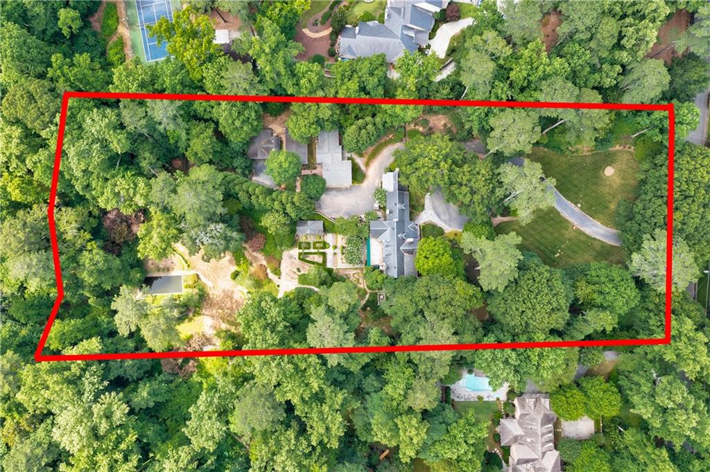 Breathtaking 4 acre estate property located on the best stretch of Tuxedo Road. T.S. Adams & Land Plus plans in place to build a spectacular estate home, annex/guest house, pool house, pool & tennis court & building permit (house removal) are all in place. Create a new landmark Tuxedo Park estate or renovate the existing home. Buyers choice. Much of the time and work has already been done. All plans, permits & surveys are included in purchase price of the property.