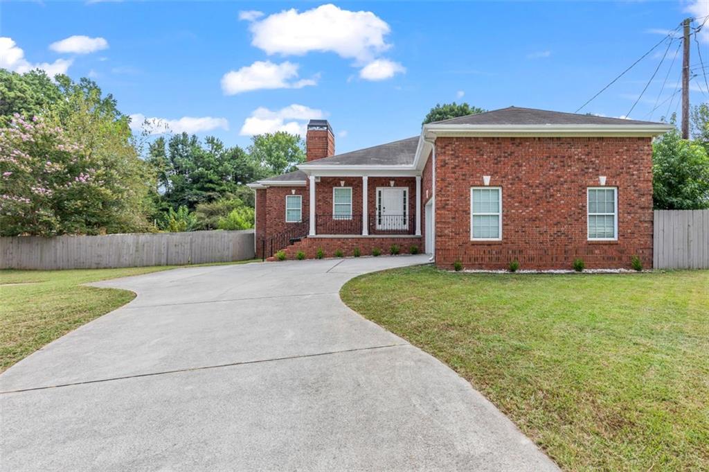This beautiful renovated brick home is located in one of Hapeville’s most sought after neighborhoods. Walk into the open concept floorplan, from the spacious living room with a gas chimney to the tiled dining area and kitchen. The stunning kitchen was recently remodeled
and features white cabinets, quartz countertops, marble backsplash, gold fixtures, a large island with breakfast bar, & a full stainless steel appliance package. The primary suite features a walk-in closet and a Pinterest worthy bathroom with a rain shower, a double vanity, and a
soaking tub. The secondary bedrooms are spacious and each have their own, private bathroom. The attached 2 car garage features an EV charger. The backyard is fully fenced while out front, the paved driveway offers plenty of space for parking. Optionally, with an additional fee, this home can be leased out with all or some of the furnishings pictured. The home is in a prime location, a quiet and safe neighborhood that is only minutes away from downtown ATL, the airport, Porsche, shopping, restaurants, and parks/playgrounds.