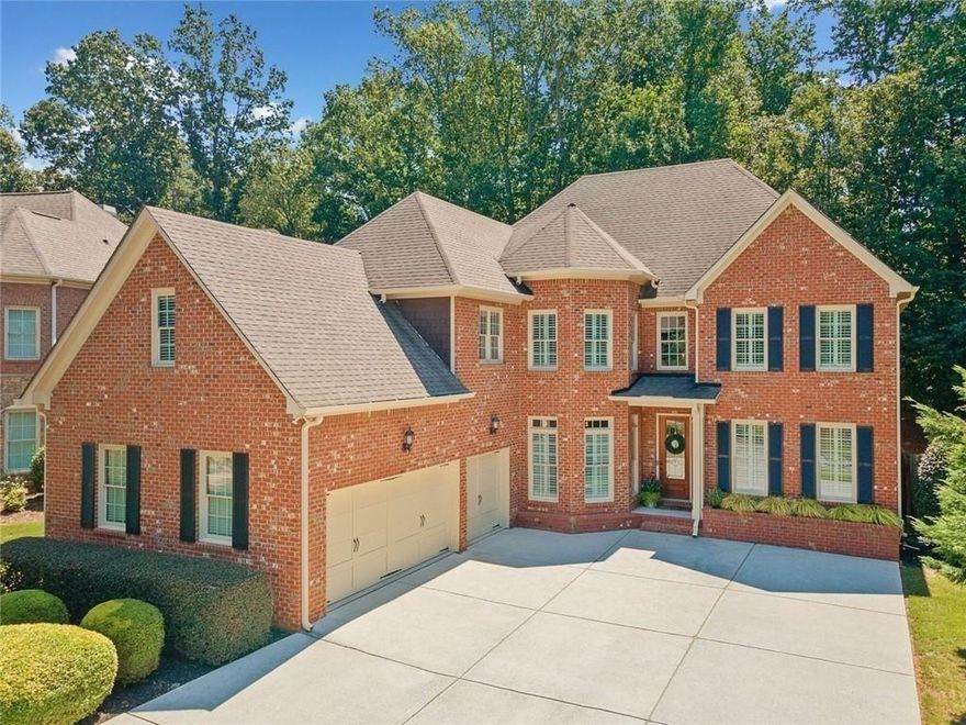 Welcome to 4550 Wigley Estates Road - a stylish executive home in East Cobb! This beautifully updated 3-sided brick residence offers the perfect blend of luxury, functionality, and location. Nestled on a private, flat, fully fenced lot with mature trees, this home features a 3-car garage and a spacious, thoughtfully designed floorplan ideal for modern living. Step inside to discover new LVP flooring throughout the main level, fresh neutral paint, and striking updated lighting fixtures. The home exudes contemporary elegance, with soaring ceilings and stylish finishes throughout. The powder bath has been fully remodeled and features a dramatic black Calacatta Monaco waterfall sink that makes a bold statement. The main level includes a dedicated office and a versatile guest suite with an ensuite bath - currently used as a home gym. Entertain effortlessly with a formal dining room, a spacious family room with an updated fireplace, an additional cozy sitting room, and a second updated fireplace for added charm. Culinary enthusiasts will appreciate the well-appointed kitchen, complete with stainless steel appliances, and ample cabinetry. Upstairs, retreat to the expansive primary suite with a serene sitting area, luxurious bathroom with his-and-hers vanities, a soaking tub, separate shower, and an impressively large walk-in closet. Two secondary bedrooms share a convenient Jack-and-Jill bath, while a third bedroom enjoys its own ensuite. A large bonus room completes the upper level - ideal as a media room or home theater. Located approximately a mile off Sandy Plains Road, this home is minutes from shopping, dining, and entertainment in both Downtown Woodstock and Downtown Roswell. Zoned for top-rated East Cobb schools, this property offers exceptional value and lifestyle in one the area's most sought-after communities. Stylish, spacious, and move-in ready, this one checks all the boxes. Come see it for yourself!