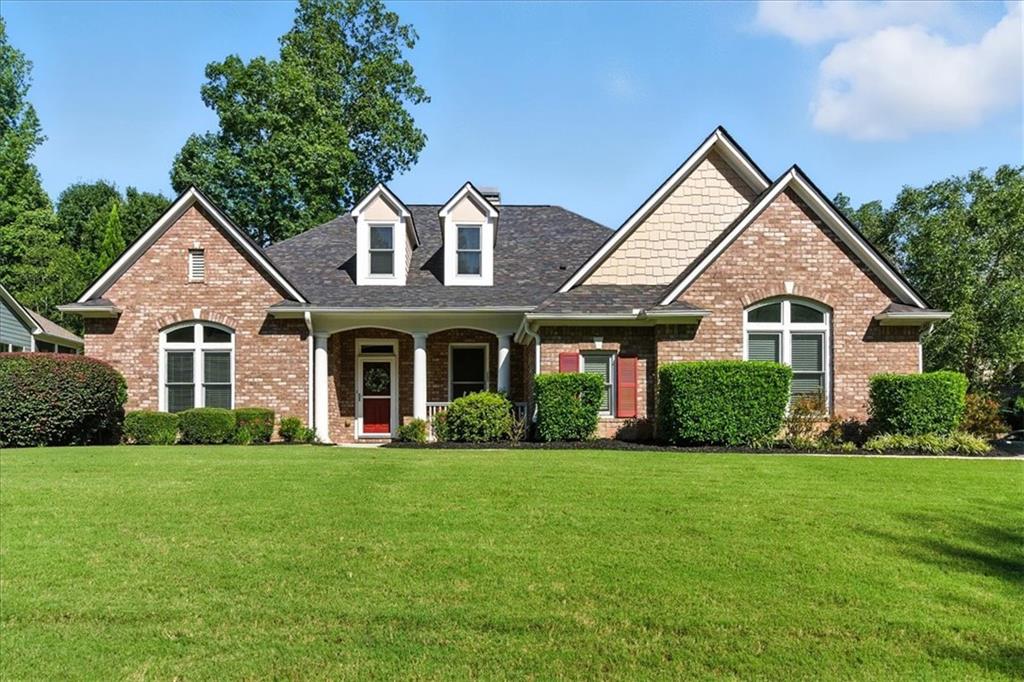 Welcome to your SPACIOUS RANCH home in the heart of Woodstock! This 4 bedroom, 3.5 bathroom, OPEN FLOORPLAN home sits majestically on a large CORNER LOT and beautifully landscaped yard. Put a few rocking chairs on the COVERED FRONT PORCH and sip your morning coffee. Upon entering the home you are greeted with an abundance of NATURAL SUNLIGHT from the high ceilings and large windows throughout the home. On your left there is a SEPARTATE OFFICE space with french doors. Easily flow in to the family room, dining room and FABULOUS KITCHEN. You will never run out of STORAGE in the bright kitchen, and the LARGE CENTER ISLAND is perfect for extra prep space or seating for guests. The OVERSIZED MASTER bedroom and bathroom can be your private oasis. Three other bedrooms are down a separate hallway from the master bedroom for added privacy. But even more awaits upstairs where you will find a huge BONUS ROOM that could be used as an entertainment area, exercise room or even a 5th bedroom. The Newcastle Farms community offers an active lifestyle, complete with tennis courts, a playground and large pool. It is located conveniently between Downtown Woodstock and Hickory Flat in the Prestigious River Ridge School District. You are only moments away from shopping, great restauants, highways and healthcare.