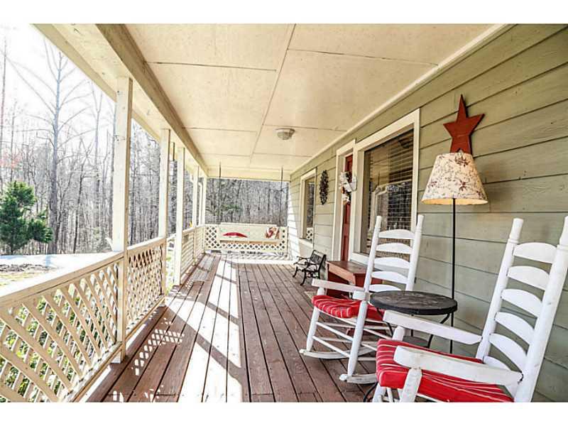 From the moment you step on the southern wrap around front porch, you'll fall in love!  This home has it all.  A corner lot of 2 acres, an amazing view, the convenience of living near everything, and the character of an antique-aged home that has been upgraded in every way imaginable!  You will not be disappointed in scheduling a visit to see this home.  The gleaming hardwood flooring, the granite countertops, the upgraded moulding... the upgrades are endless!