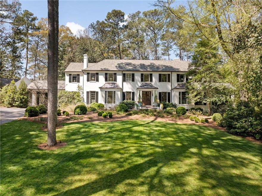 Ideally situated in Historic Tuxedo Park, this exquisitely renovated home blends historic charm with contemporary sophistication.The thoughtfully redesigned main level is an entertainer’s dream, offering multiple living spaces, a stunning banquet-sized dining room, and an inviting pub/lounge for intimate gatherings. The stunning eat-in kitchen features an expansive L-shaped island, convenient caterer’s area and a large breakfast room with built-in banquette seating. The adjacent screened-in porch features a cozy wood-burning fireplace creating the perfect atmosphere for year-round enjoyment. A seamless walk-out to the backyard reveals a resort-style oasis, complete with a sparkling pool, expansive bluestone patio, and manicured, level grounds. The primary suite is a sanctuary of luxury, boasting dual walk-in closets and a spa-like marble bath. Three additional en-suite bedrooms and an upstairs den provide comfort and flexibility. A newly constructed entertainment pavilion impresses with a vaulted, wood-beamed ceiling, state-of-the-art golf simulator, full bar, and bath - offering the ultimate leisure space. Meanwhile, a charming guest cottage with two bedrooms, a full bath, kitchen, and living room ensures privacy and comfort for visitors. Additional highlights include a whole-house generator, iron doors, and wood beamed ceilings, gleaming hardwood floors throughout—a rare blend of classic craftsmanship and modern convenience.