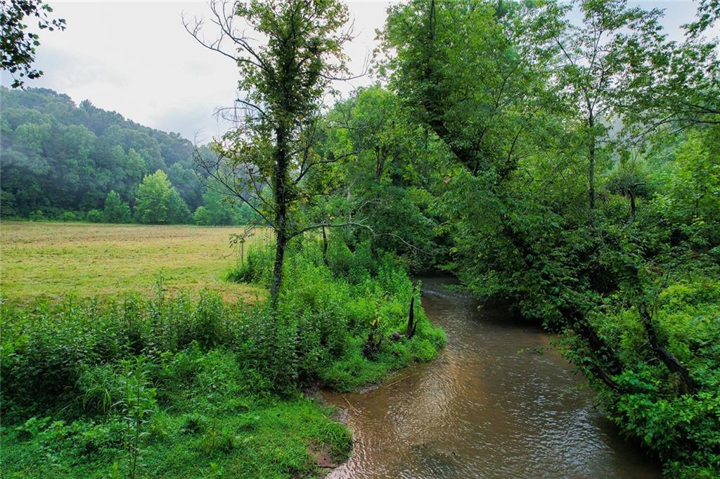 Discover your dream property with this rare combination of pasture and creek frontage, across two lots totaling 6.46 acres. Lot 3, already designated with a 911 address at 1055 New Liberty Trail, boasts 3.18 acres and includes a septic permit. Lot 2 comprises the remaining 3.28 acres, offering ample space for further expansion or customization. Combined these lots contain approximately 3.5 acres of pastureland and nearly 1000 feet of creek frontage along Newberry Creek and Mill Creek. Surveys, soil testing documentation, and underground power are available for both lots.