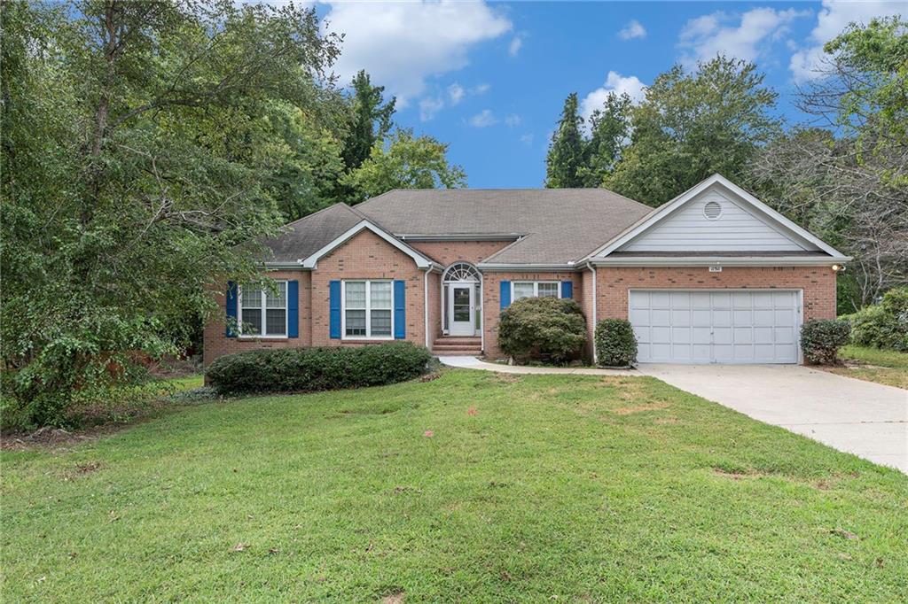 This stunning four-sided brick ranch offers 3 bedrooms and 2.5 bathrooms, combining timeless charm with modern comfort. The spacious eat-in kitchen is perfect for family meals, while the inviting family room features hardwood floors and a cozy fireplace. The oversized primary suite boasts a trey ceiling, a generous walk-in closet, and a spa-like ensuite with a double vanity, garden tub, and separate shower. Enjoy outdoor living on the large deck overlooking a beautifully landscaped, private backyard—ideal for relaxing or entertaining. Nestled in a quiet, welcoming neighborhood with abundant natural light, this home offers exceptional curb appeal and no HOA. A two-car garage completes this must-see property.