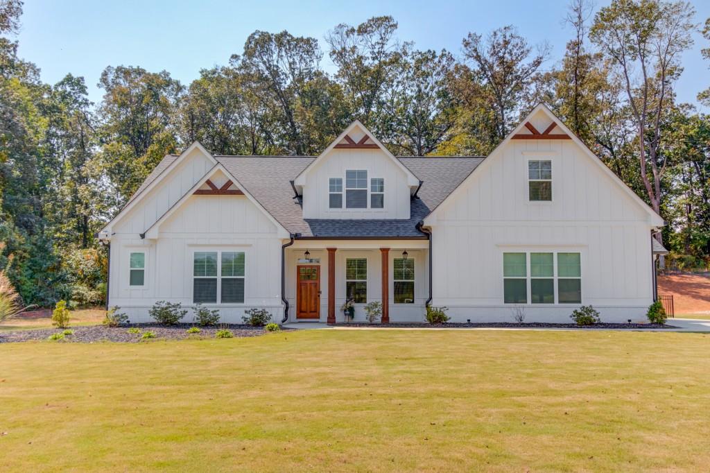 Every home tells a story and this one begins on Storey Lane. Set in the coveted Jefferson City Schools district, this 4-bedroom, 4.5-bath farmhouse-style home offers over 3,700 sq. ft. of thoughtfully designed living. At its heart is a gourmet kitchen a chef's dream with a gas cooktop, double ovens, a large island with bar seating, and quartz countertops. Wide-plank LVP flooring ensures easy upkeep, while the spacious main-level owner's suite delivers spa-like comfort with an oversized rainfall shower. Upstairs, you'll find two bedrooms each with ensuite baths plus a loft with projector wiring in place, ready to become your personal theater, and convenient walk-in storage. Outdoors, your private retreat awaits. An 18' by 36' gunite saltwater pool with tanning ledge, two bubblers, umbrella sleeve, and a 7' hot tub with waterfall overflow set the stage for relaxation. Evening elegance comes alive with a landscape lighting system in the front and app-controlled, color-changing LED pool lights in the rear. A pool robot and two ledge loungers are included for effortless enjoyment. Designed for entertaining, the grilling pad is prepped with a water line for a future outdoor kitchen and a gas line for grilling. Sitting on over an acre, this property also offers no HOA, an expanded turn-around driveway, and ample space for RV or boat parking a rare blend of freedom and luxury. This home truly checks every box: luxury, lifestyle, and location. Don't miss your chance schedule a showing today before this Storey ends!