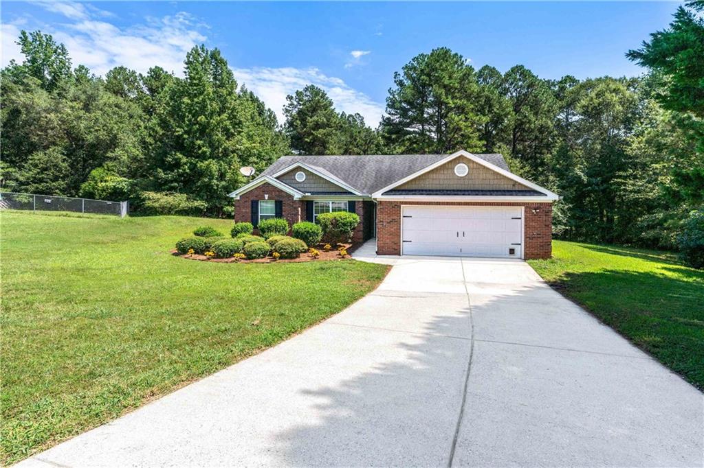 Beautiful ranch four sided brick house in Jefferson Heights subdivision with 2.5 acres in a quiet neighborhood, the largest in the neighborhood and also in the cul-de-sac. No HOA. A detached office space professionally built, finished, with power and breaker box right in your back yard for any of your professional or personal needs. Vaulted living room ceiling, laminate flooring, new roof, new carpet, new HVAC coil, HVAC is only a few years old. A pergola on the back patio so you can sit and enjoy the beautiful wooded scenery. It's everything you could want with a fireplace, spacious two car garage and street lights. A middle school and elementary school right up the street and Winder-Barrow high school. Agent Owner/Seller #373513.