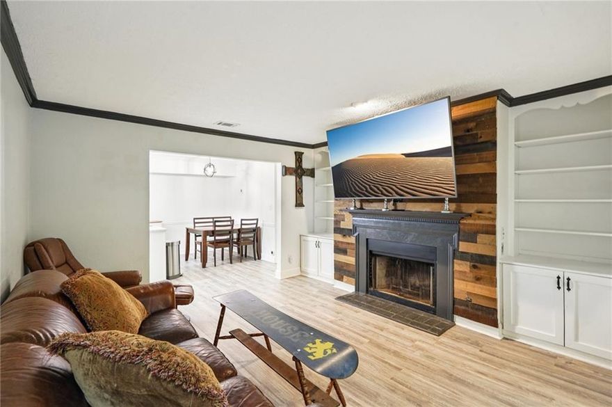 Welcome home to this charming Decatur condo, close to Emory and the CDC, showcasing the perfect blend of comfort and style. Step inside and discover a delightful living space with LVP floors throughout that offers everything you need for a cozy home grounded by an inviting living room with built-in bookcases surrounding the wood burning fireplace. The chef of the home will love the renovated eat-in kitchen boasting stone countertops, Stainless Steel appliances and ample space for hosting friends and family for supper club! Sneak off for some relaxation in the late afternoon or jump start your morning with a cup of coffee in the sunroom off the main living space. Flooded with natural light, this cozy corner will continually brighten your day. Take the party outside to the covered patio where you can dine alfresco or simply unwind with a book overlooking the green space of the community. Retreat to one of two spacious bedrooms situated in a roommate floor plan with each bedroom large enough for a king size bed. Don't miss the community pool and tennis courts and take advantage of hosting friends and family with ease with ample community parking. Conveniently located in Decatur near the upcoming Lulah Hills Development, where you’ll find access to restaurants, shopping and local amenities at your fingertips! Don’t miss this opportunity to call this fully renovated condo in Decatur home.