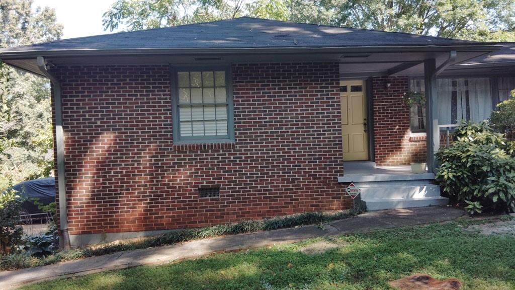 An awesome find for the first time home owner or the savvy investor. Homes sits back from street with long unpaved driveway. Natural privacy with beautiful bushes and trees that gives a sense of serenity and safety. Cozy Four sided brick home with front and back porch. Living space includes 3 bedrooms and bonus room that can be used as 4th bedroom, open kitchen and dining room, and living room with hardwood floors except kitchen and bathrooms. .5 acres of land, Lots of yard space on all sides.
Full unfinished basement interior and exterior exits, laundry area, can be upgraded for extra living space.
Minutes from I-285, hospitals, shoppings, Stone Mountain Park, Arabian and Panola Parks. An easy 25 minutes to Downtown Atlanta
