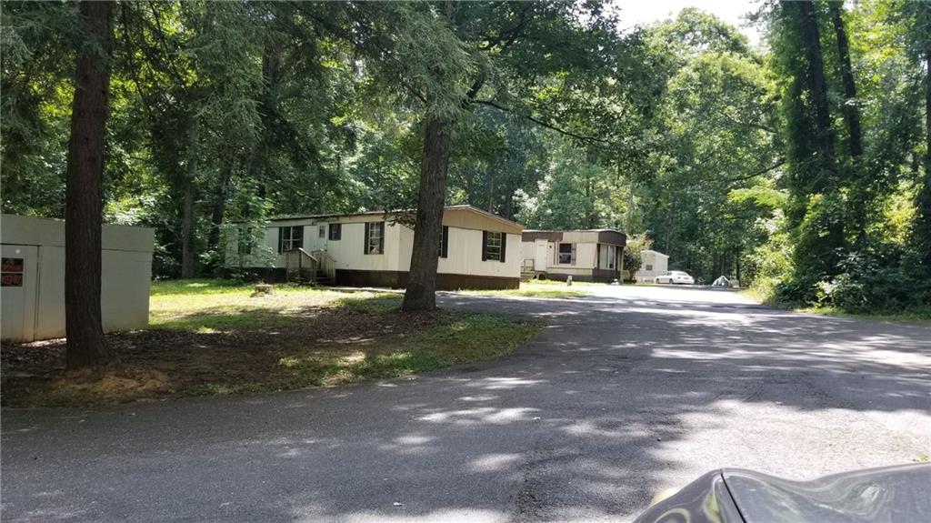 This property was a Mobile home park operated for 30 years. Currently, all the mobile homes have been removed and this is considered a land sale that can be used as a self-storage lot or a number of other uses which aligns with the comprehensive land uses plan by Bartow county.
The property is located just south of Lake Point Sports Complex and 1 block from Lake Allatoona. Located on Old HWY 293, this 4.5-acre property is flat with a small creek running through thus providing a charming setting while perfectly located to take advantage of growth around the area. Further, 2 year ago Amazon built a 250k distribution warehouse 1/4 mile from the property and most recently, Emmerson Industrial Park is building multiple large distribution warehouses directly behind the subject property. Fast close is important and cash is king!
All investors hurry!!! Opportunity is calling!!