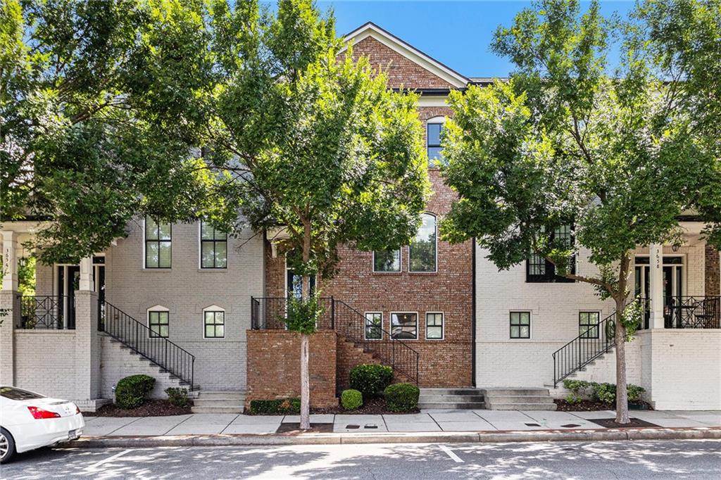 Welcome to this beautiful 3-bedroom, 2.5-bath townhome ideally located in the heart of Suwanee! The spacious kitchen features solid-surface countertops, black appliances, a large pantry, and a functional layout perfect for everyday living. Relax in the cozy family room with its inviting brick fireplace, and retreat to the primary suite with a tiled shower and dual vanity. Carpet and tile flooring throughout provide comfort and durability. Downstairs, you’ll find unfinished space offering the opportunity to expand—perfect for creating an additional living area, home office, or gym, adding both square footage and value. Just steps from Suwanee Town Center, enjoy walkable access to shops, dining, community events, and the scenic Suwanee Greenway. Don’t miss this incredible opportunity in one of Suwanee’s most vibrant communities!