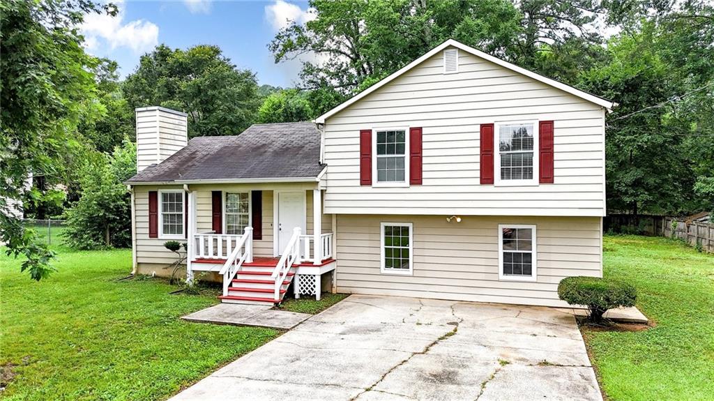 Welcome to this inviting 3-bedroom, 2-bathroom split-level home nestled on a spacious level lot in one of Cartersville’s most convenient locations. Just minutes from I-75, Hwy 41, shopping, dining, and recreation, this property offers the perfect blend of comfort and accessibility. Step inside to a warm and welcoming family room featuring a beautiful fireplace—ideal for cozy evenings at home. The functional layout includes an unfinished basement, offering endless possibilities for expansion, a workshop, or extra storage.
Enjoy summer evenings on the deck, perfect for grilling out and entertaining family and friends. With its fantastic location, classic charm, and great potential, this home is a must-see! Schedule your tour today and explore the possibilities!