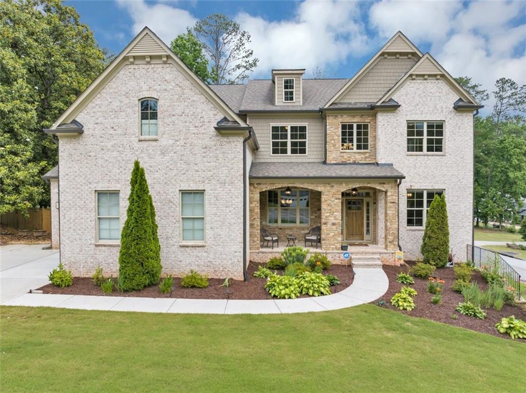 Custom-Built Elegance in the Heart of East Cobb!
Welcome to 3459 Clubland Drive, a stunning custom-built, four-sided brick designed estate located in the prestigious Indian Hills Country Club community
in the Walton High School District. Nestled on a beautifully landscaped 0.67-acre corner lot, this 6-bedroom, 5.5-bathroom masterpiece offers luxury, space and exceptional craftsmanship throughout. Step inside and be greeted by soaring 10-foot ceilings (on all three levels), creating an open and airy atmosphere ideal for both comfortable living and elegant entertaining. The spacious floor plan features a family room with a fireplace, a grand foyer, formal living and dining areas. You’ll find exquisite wide planked hardwood floors throughout giving the home a warm and inviting feel. A gourmet home-chef’s dream kitchen with more counter space than you can dream of! Outfitted with top-of-the-line appliances, gas cooktop, double ovens, custom cabinetry, quartz countertops, extra-large kitchen island, with plenty of cabinet storage along with a walk-in pantry. The main level includes a private guest suite “wing” with a dedicated private bathroom and a generous walk-in closet. Also located on the main floor is a mudroom designed for backpack and shoe storage and a half-bath located off of the kitchen. Upstairs, you'll find three oversized secondary bedrooms with en-suite bathrooms and ample walk-in closets as well as a sixth bedroom that may be used as a bedroom or Media/Playroom. Additionally, upstairs you will find the spacious owner's suite including a gorgeous spa-like bathroom. Separate vanities, separate tub and shower along with the "Diva" closet that is perfect for her. And a separate walk-in closet for him. The Laundry room conveniently located upstairs offers plenty of space and shelving for storage. The full terrace level is unfinished but perfect for future family room, game room, exercise room, theater room, and another bedroom suite, and has access to the expansive flat backyard-a rare find and perfect for a future pool or outdoor oasis. Located on a corner lot, entrance into a cul de sac along with a 3-car garage and extra parking pad. The beautifully landscaped yard is equipped with an irrigation system. As a resident of Indian Hills, you'll have access to the exclusive Indian Hills Country Club, a haven of luxury and leisure. Enjoy 27 holes of golf, eight tennis courts, and three swimming pools, along with a beautiful clubhouse offering exquisite dining and a host of year-round social events. Walk to Home Depot, Whole Foods, Target, and an array of shopping and dining options. Your children will thrive in the esteemed school district, with East Side Elementary, followed by Dickerson Middle School and the Nationally recognized Walton High School. Easy access to 75, 400, and 285. The location is everything you ever wanted! Just minutes from Sandy Springs and Roswell. No rent restrictions. No HOA
