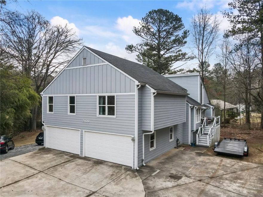 Beautifully renovated Modern Contemporary spacious home has all the bells and whistles you expect. Real hardwood flooring throughout the home and porcelain flooring in the kitchen and bathrooms. Nice layout with cathedral ceiling in the living room, separated dinning area . All good sizes bedrooms and an oversized owner suite. Plenty of cabinets and a walking pantry for storage at this top quality Gourmet kitchen that has quartz countertops and an inviting island for friends gathering and entertainment . All windows are double pane and insulated. Roof, HVAC (2) and siding are all newer as this home had a major renovation about 8 years ago. Need parking for you RV or Boat? Look no further, this home a double garage and lots of parking pad.