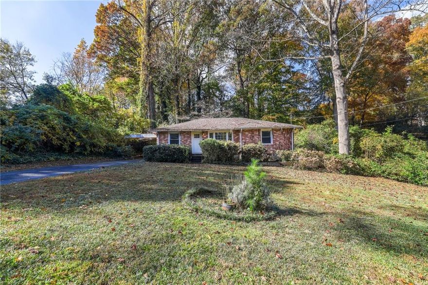 Conveniently located close to everywhere you want to be in Decatur, this mid-century brick construction home with updated windows is brimming with “dream home” potential. Enter into a well-sized family room with original hardwood floors that run throughout much of the home. Pass through a separate dining room into the home’s kitchen with rear patio access. The home’s three bedrooms are well-sized; one with rich wood paneling and another with dual closets. A hall bathroom features tile wall accents and tub surround. Out back, a brick pathway leads to a detached brick patio that’s great for entertaining or relaxation. Close to  dining, shopping, parks + minutes to Emory and CDC.