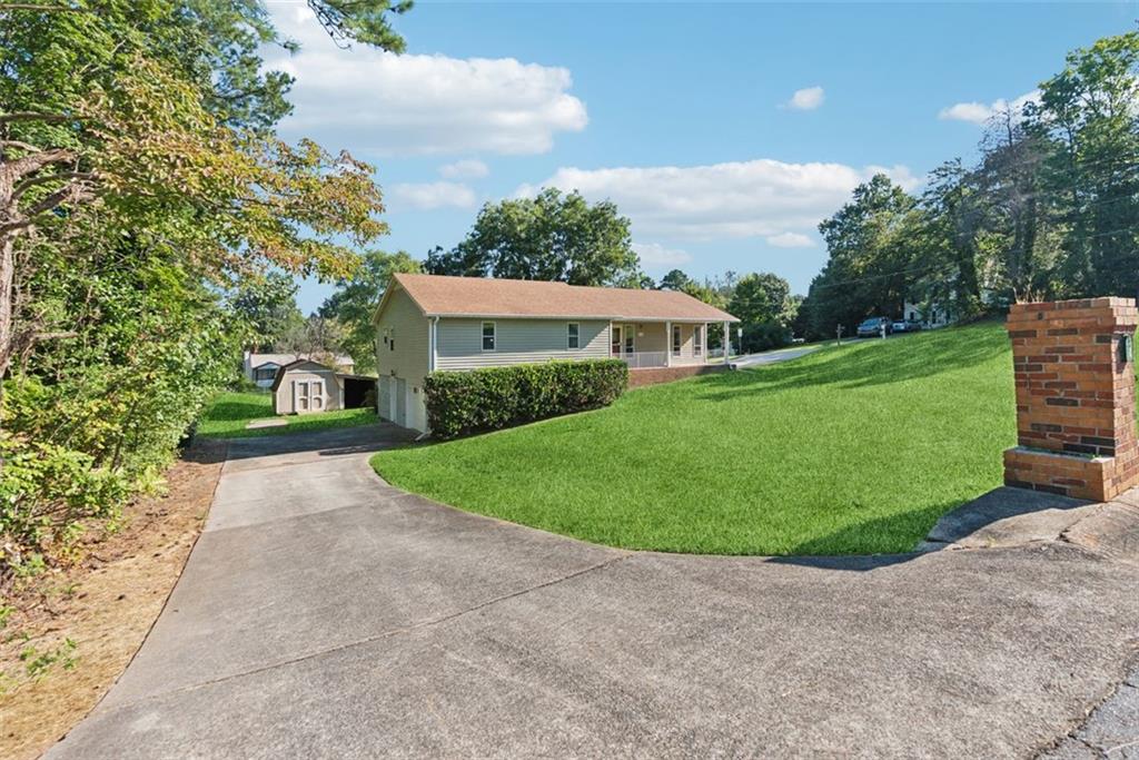 **Charming 3-Bedroom, 3-Bathroom Ranch Home with Finished Basement in Woodstock, GA – Move-In Ready!**
This beautifully updated ranch-style home in Woodstock, GA, is a true blend of comfort, style, and modern upgrades! Offering 3 spacious bedrooms and 3 full bathrooms, including a full bath in the finished basement, this home is perfect for families or anyone who loves the convenience of main-level living with extra space below.
**Key Features:**
* **Main Level:** Gleaming hardwood floors extend throughout the main floor, which includes 3 spacious bedrooms and 2 fully updated bathrooms with elegant tile flooring. The kitchen is a chef's dream with gorgeous **granite countertops** and plenty of cabinet space, making meal prep a breeze.
* **Finished Basement:** The fully finished basement is a standout feature, complete with brand-new LVP flooring and a full bathroom, making it a perfect spot for an in-law suite, guest retreat, or entertainment area.
* **Sunroom:** Relax and unwind in the bright, airy sunroom featuring new LVP flooring, providing a peaceful space to enjoy year-round.
* **Updated Bathrooms:** Both bathrooms on the main level have been beautifully renovated with modern tile floors, sleek finishes, and updated fixtures.
* **Workshop:** The spacious workshop in the backyard, complete with electricity, is perfect for DIY projects, crafts, or additional storage, offering extra space for hobbies and activities.
**Additional Features:**
* Award-winning schools nearby, ideal for families.
* Convenient location close to shopping, dining, and entertainment in Woodstock.
* Easy access to major highways for a quick commute to Atlanta.
This home is move-in ready and offers the perfect combination of comfort, space, and modern living. Don’t miss out—schedule your private showing today!