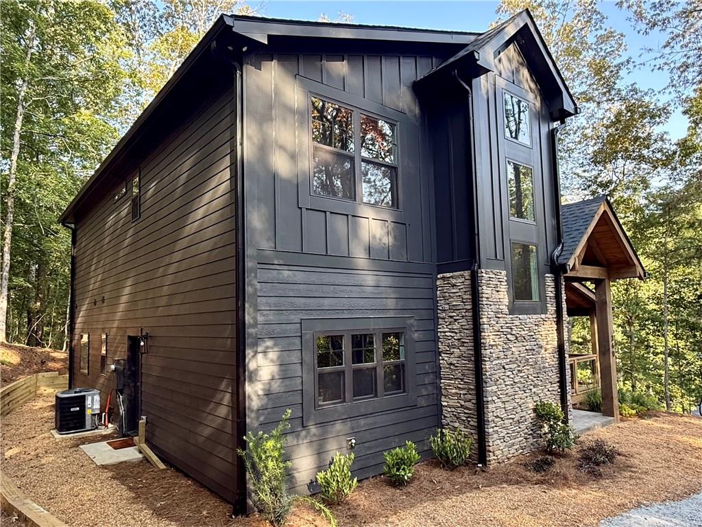 Modern Craftsman meets Mountain Luxury in this rustic chic retreat! Experience refined mountain living in this stunning 3BR/2.5BR home, thoughtfully designed to blend clean architectural lines with natural elements. Set in the heart of the North Georgia Mountains, this new construction opportunity dream retreat is in one of the region's most sought after gated, resort communities. This home sits a short distance inside the gates on a paved road. Coosawattee River Resort provides easy access to Ellijay, Jasper, and Blue Ridge, with hiking, mountain biking, wineries, shopping, and dining all nearby! Community amenities include, gated entry, nature trails, river access, outdoor pavilion and playground, 2 outdoor pools, rec center with indoor pool, game room, fitness center, tennis, and pickleball. This stunning home is perfect as your primary residence, a vacation getaway, or an excellent addition to your portfolio of investment properties! This home is complete and ready for you to call home. This is the mountain lifestyle you have been dreaming of!