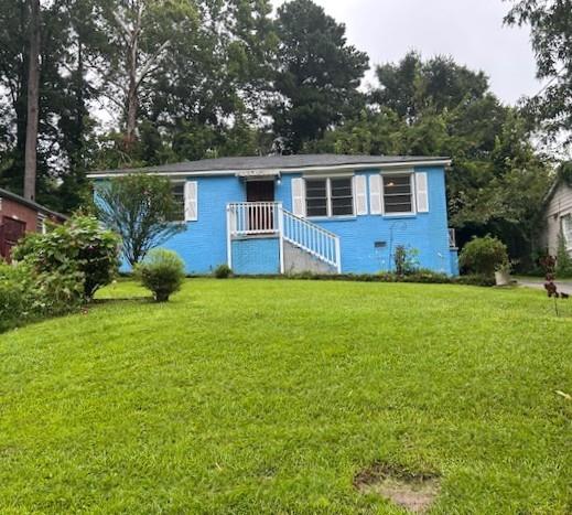 Come explore this incredible opportunity to own a charming 4-sided brick ranch just minutes from I-85, I-75, shopping, public transportation, and the vibrant Downtown Hapeville—home to eateries, shops, parks, and more. Step onto the inviting front porch and inside to a spacious living and dining area featuring abundant natural light streaming through the large windows. Down the hall, you'll find three spacious bedrooms and a freshly renovated full bath. The flexible floor plan offers exciting possibilities as both a forever home or rental property. Summer days are a breeze thanks to the newer HVAC unit. A private backyard offers ample room to garden, throw a football or just relax and enjoy the serenity. Rare opportunity to get into a move in ready home for under $150K.