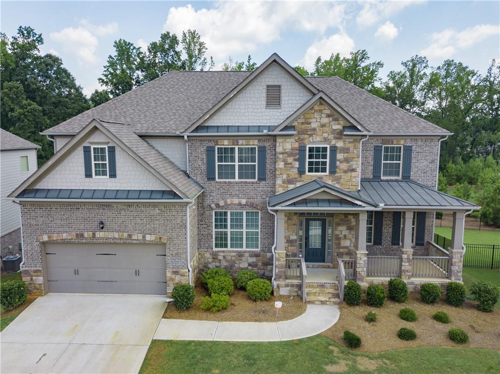 Fabulous house, WEST FORSYTH HIGH, VICKERY ELM. & MID SCHOOLS! Perfect location for shopping & Lake Lanier. Home offering all the bells & whistles of the unfinished Terrace floor! Spacious Family room. Enormous gourmet Kitchen, w/oversized island open to the keeping room with stacked stone fireplace Great size formal dining room. Hardwood floor throughout. Bedroom w/f. bath first floor. Unique oversized Media room, large 5th bedroom w/ private bath. You are sure to fall in love with the flat private backyard. Excellent Amenities, Clubhouse, swimming pool, tennis court, Playground. Conveniently close to GA400. 10 Min to Big Creek Greenway trail, shopping, and dining! Minutes to Vickery Village, Polo Golf Club, The Collection, and Halcyon. 20 Min to GA Outlets. For review, access with your suprakey.